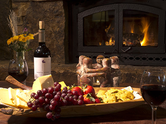 Luxurious spa party setup with wine, cheese, and elegant ambiance