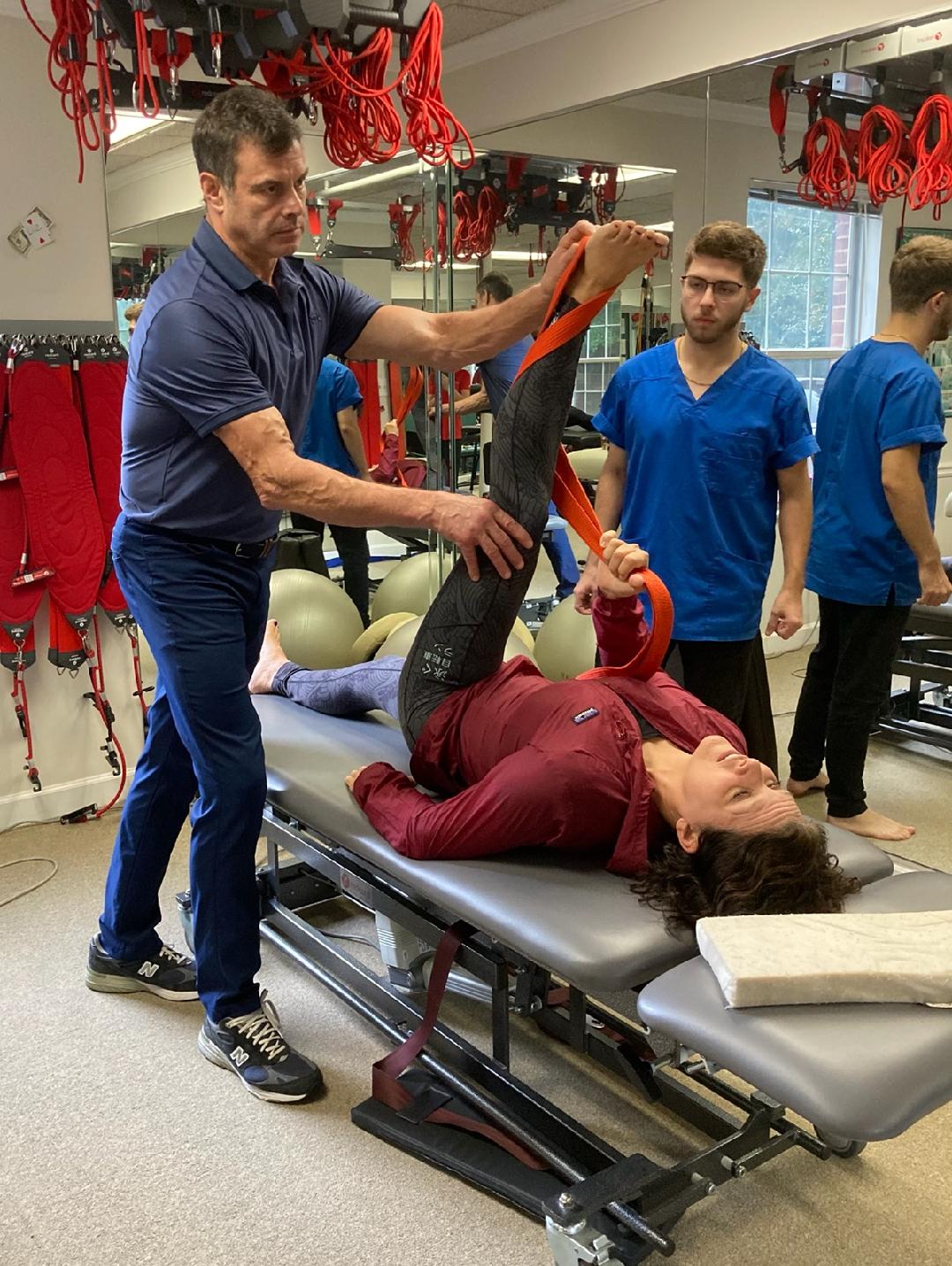 Assisted leg stretching with professional equipment